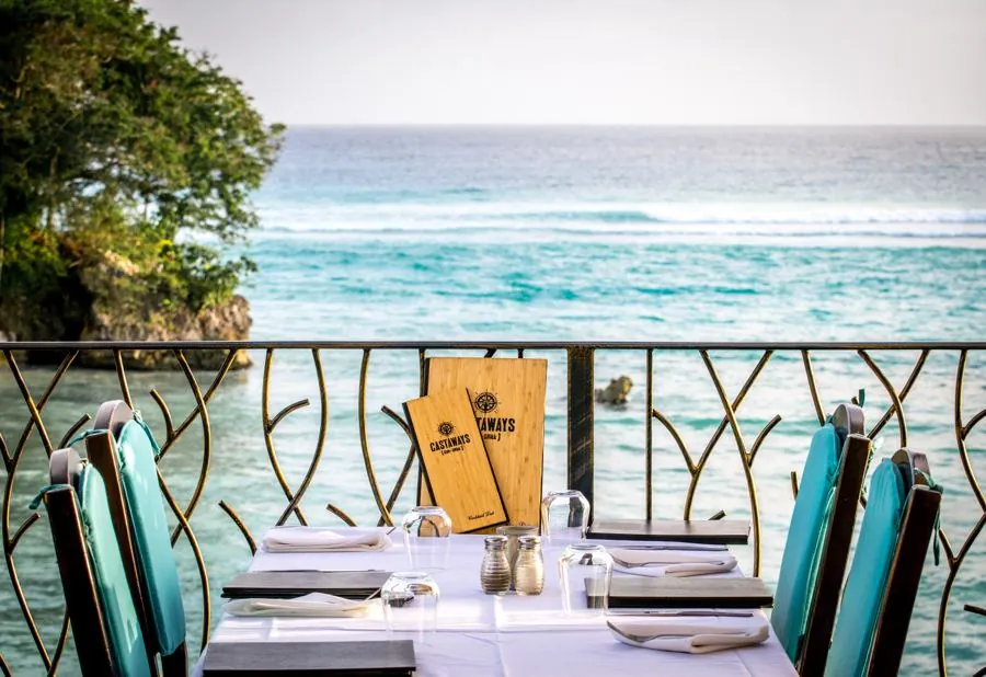 Waterfront dining on the open-air upper deck at Castaways, St. Lawrence Gap